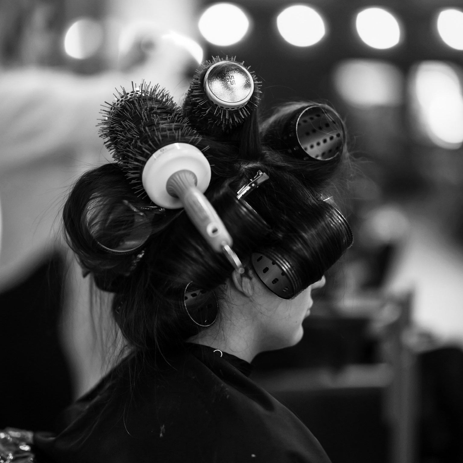 Woman getting a round brush blowout at Salon Two Zero NIne